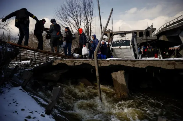 Civilians have been fleeing Irpin, near Kyiv, after ceasefires were agreed