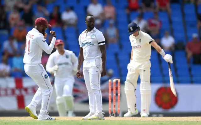 Roach celebrates Root wicket