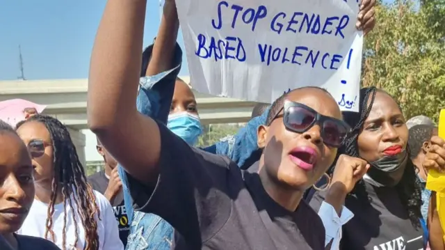 A protester holds a placard