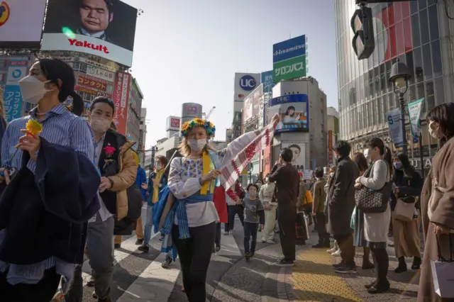 Protesters seen marching during the demonstration. Hundreds of people marched in central Tokyo protesting Russia's invasion of Ukraine. With signs demanding the end of the war and criticizing the Russian president Vladimir Putin.