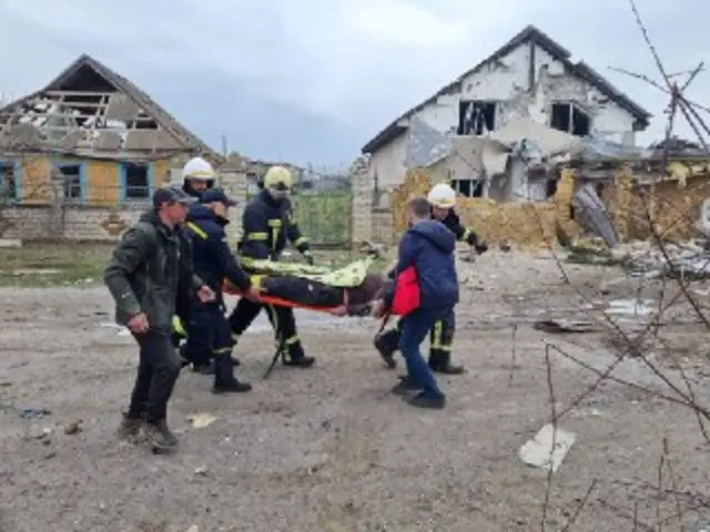 Rescuers scramble to save those trapped underneath debris in Mykolayiv in southern Ukraine