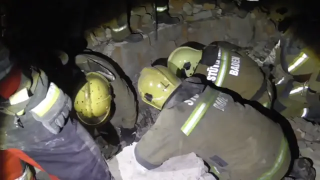 Rescuers dig through rubble in Sumy