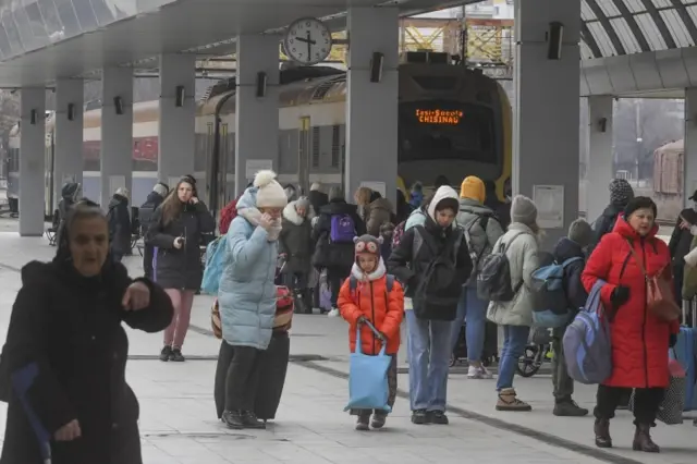 Refugees wait to enter a train to reach Romania, one of the stages of the long exodus from Ukraine, at the train station of Chisinau, Moldova, on 8 March 2022