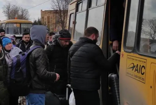 Civilians flee the city after temporary ceasefire announced on March 8, 2022 in Sumy, Ukraine