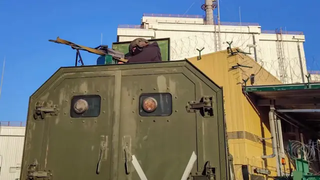 Russian servicemen guard in front of the Chernobyl Nuclear Power Plant in Pripyat, Ukraine, 07 March 2022