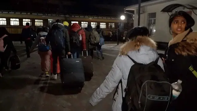 Refugees board a train from Sumy to Poltava