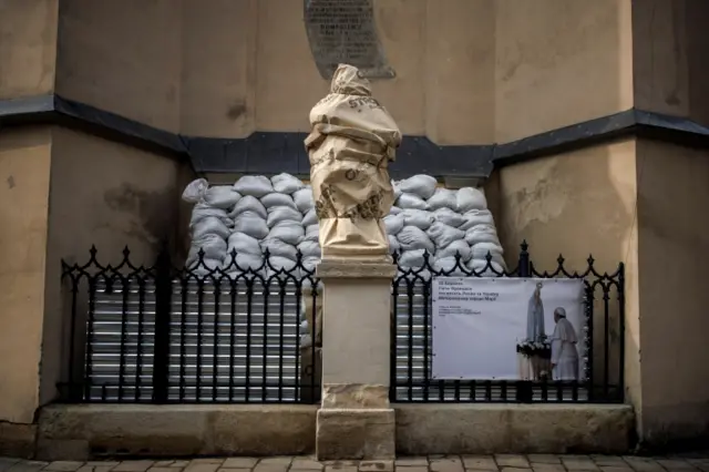 In the centre of Lviv - which is itself a World Heritage site - statues have been wrapped and surrounded by sandbags to protect them