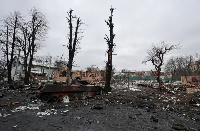 A street in Bucha with trees stripped bare