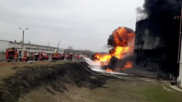 Firefighters at an oil depot on fire in Belgorod