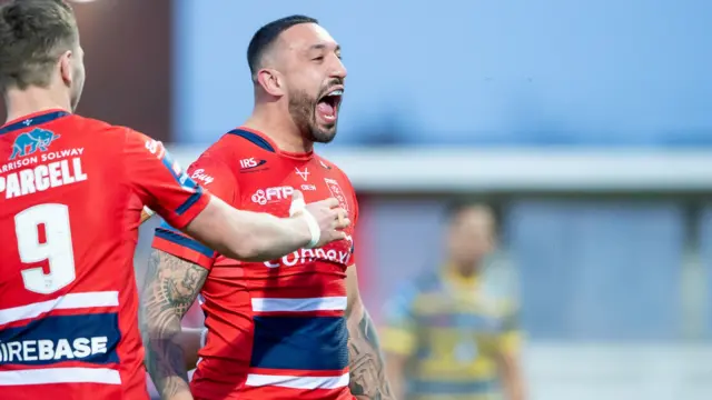 Elliot Minchella celebrates a try for Hull KR