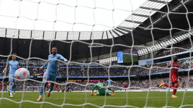 Sadio Mane (right) scores