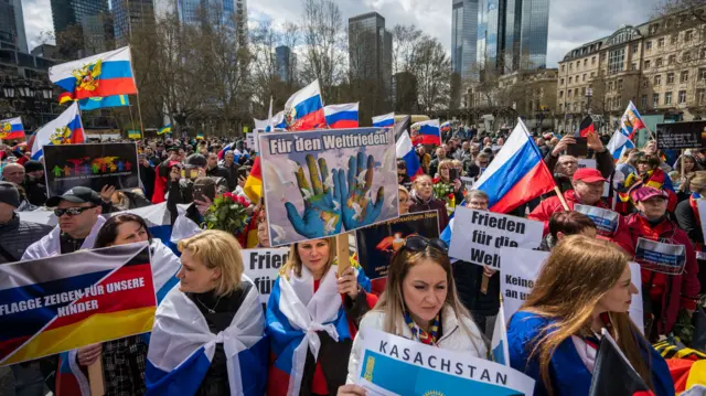 People gather to show their support for Russia at a demonstration in Frankfurt