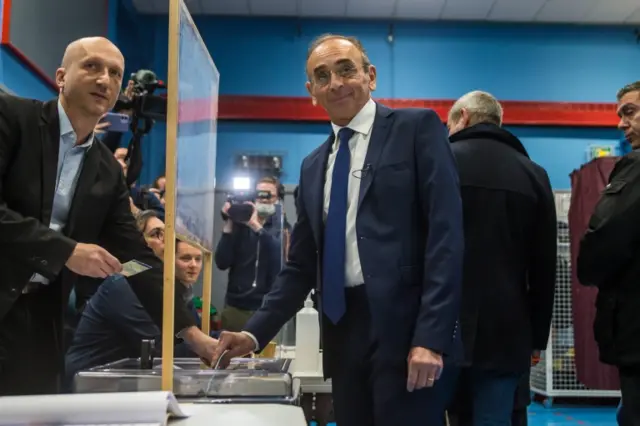 France's far-right party "Reconquete" leader Eric Zemmour (C) casts his ballot at a polling station in the first round of the French presidential elections in Paris, France, 10 April 2022