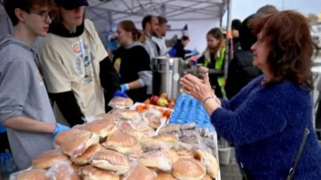 War refugees from Ukraine receive food upon arrival at the Humanitarian Aid Center in Przemysl, Poland