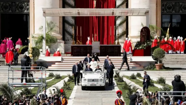 Pope Francis leaves after leading the Palm Sunday Mass in Saint Peter's Square at the Vatican