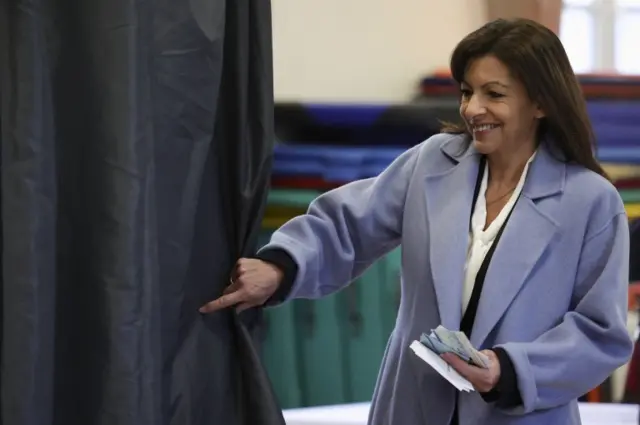 Anne Hidalgo, mayor of Paris and Socialist Party (PS) presidential candidate, enters a polling booth to vote in the first round of the 2022 French presidential election at a polling station in Paris, France, April 10, 2022