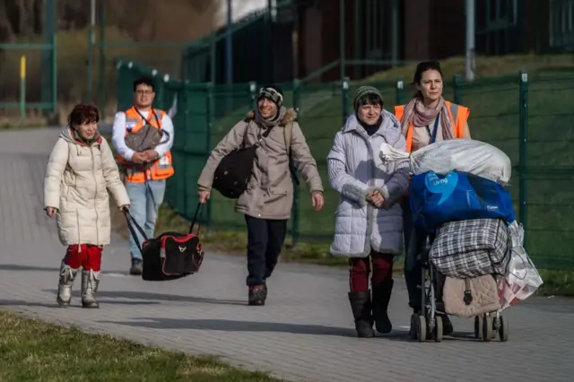 Refugees from Ukraine are seen at the Polish/Ukrainian border crossing in Medyka on 7 April