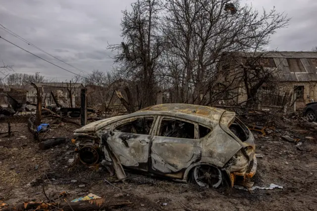 A burned-out car in the Ukrainian city of Bucha