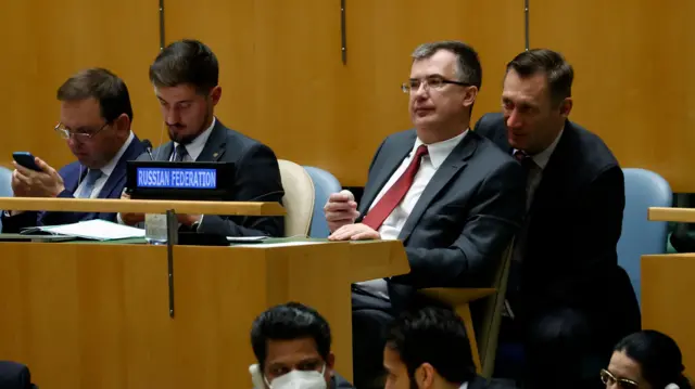 Deputy Permanent Representative of Russia Gennady Kuzmin (C) reacts after the results from voting by the United Nations General Assembly member countries pass a resolution to suspend Russia from Human Rights Council caused by Russia"s invasion of Ukraine at United Nations