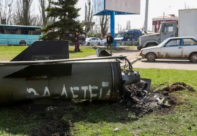 The remains of a rocket with Russian lettering on the side