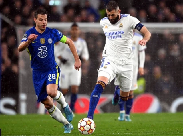 Cesar Azpilicueta and Karim Benzema