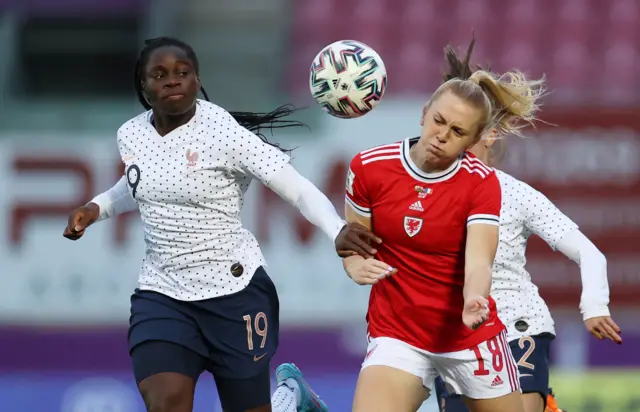 Ceri Holland of Wales is challenged by Griedge Mock Bathy of France
