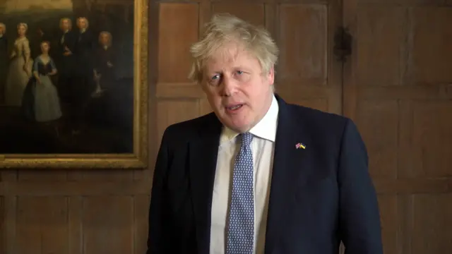 Boris Johnson delivering a statement after being fined