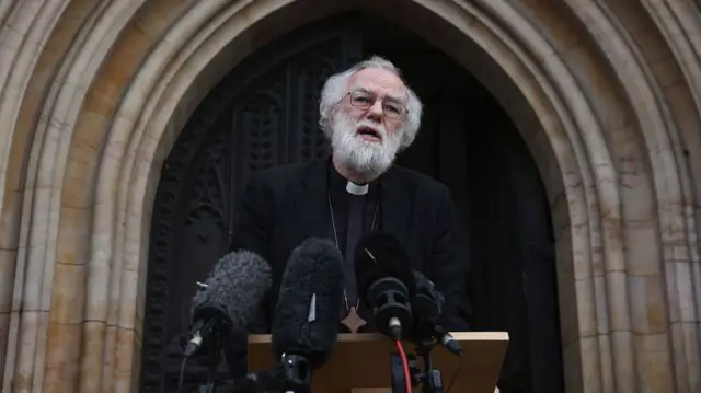 Former Archbishop of Canterbury Dr Rowan Williams speaks to the media outside Croydon Minster on October 17, 2016 in Croydon, England.