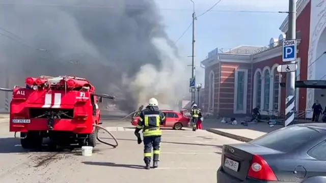 A firefighter responds in the aftermath of an attack on Kramatorsk railway station