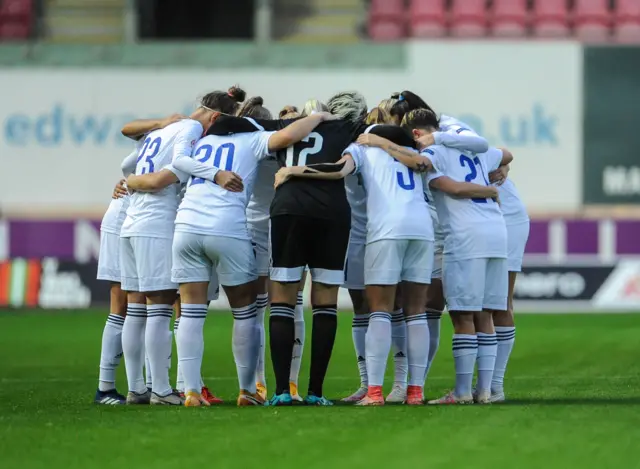 Kazakhstan players in a huddle