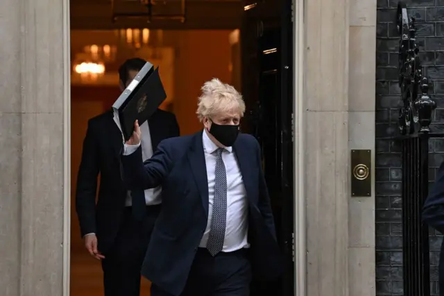 Britain's Prime Minister Boris Johnson leaves from 10 Downing Street in London on January 25, 2022.