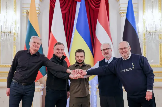 handout photo made available by Polish President"s Press Office (KPRP) shows Presidents of Lithuanian Gitanas Nauseda (L), Polish Andrzej Duda (2-L), Ukraine"s President Volodymyr Zelensky (C), Latvia Egils Levits (2-R) and Estonia Alar Karis (R) during his visit to Kiev, Ukraine 13 April 2022