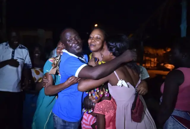 People from the Baoulé community welcome relatives arriving in Assounvoue village, central Ivory Coast, on March 30, 2018 on the eve of "Paquinou"