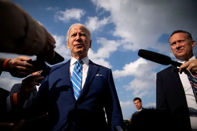 US President Joe Biden speaks to reporters before boarding Air Force One at Des Moines International Airport in Des Moines, Iowa, USA, on 12 April 2022