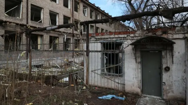 A damaged shoes factory shelled by a missile on 11 March causing the death of the facility security, in Dnipro