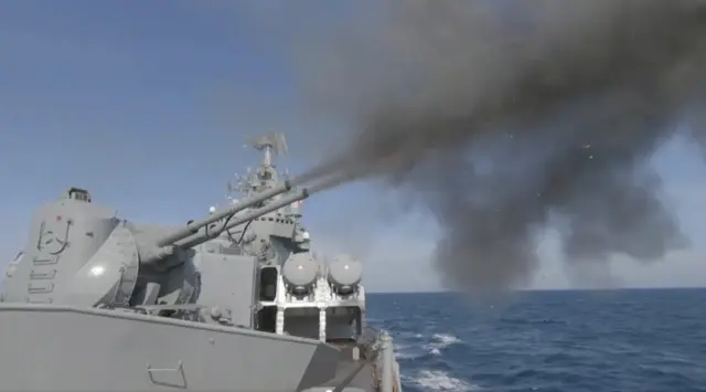 The Moskva cruiser fires guns during drills in the Black Sea. Photo: 18 February 2022