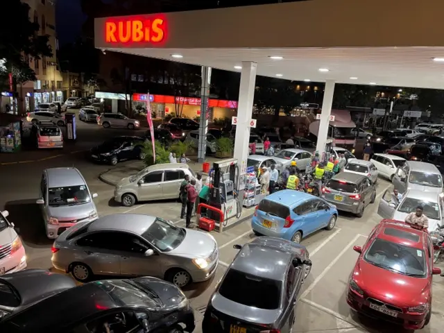 Motorists queue at a Rubis fuel station to fuel their vehicles, amid the nationwide petrol and diesel shortage,