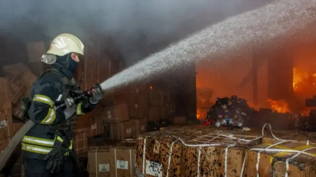 A firefighter in Kharkiv