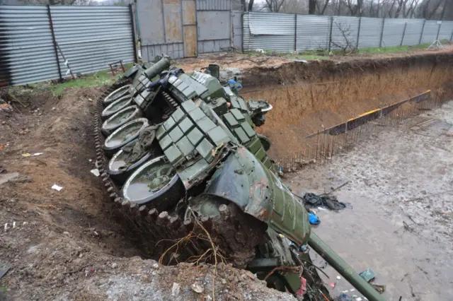 An abandoned damaged Russian tank in Russian-controlled parts of Mariupol on 13 April