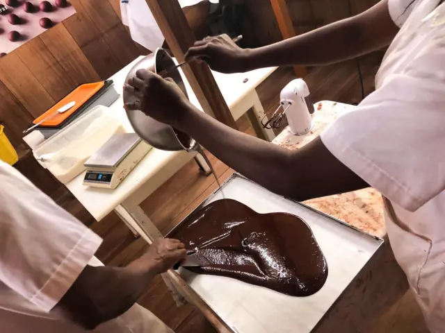 Worker making chocolate in São Tomé.