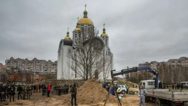 Exhumation of bodies of civilians from a mass grave in Bucha