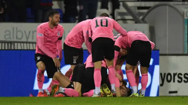 Caley Thistle players celebrate their goal during their 1-0 win on December 03, 2021