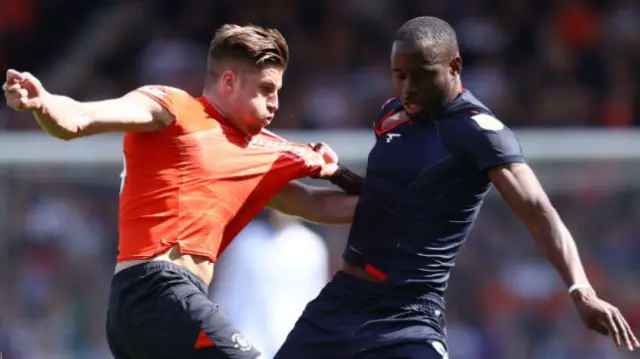 Glen Rea of Luton Town battles for possession with Sam Surridge of Nottingham Forest