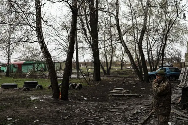 A serviceman patrols in Popasna, Ukraine's Donbass region on 14 April 2022