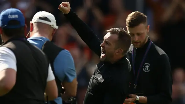 Luton boss Nathan Jones celebrates victory at the final whistle