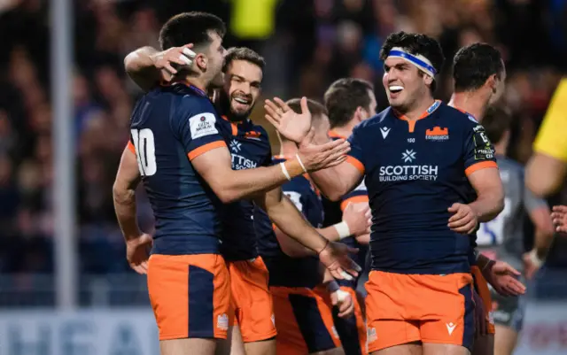 Blair Kinghorn celebrates with his teammates after scoring Edinburgh's second try of the game