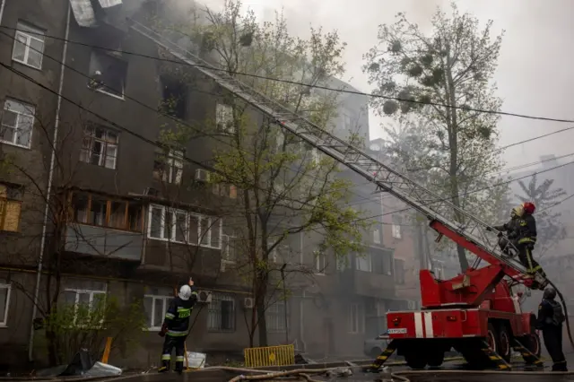 Firefighters tackle fires caused by shelling in Kharkiv