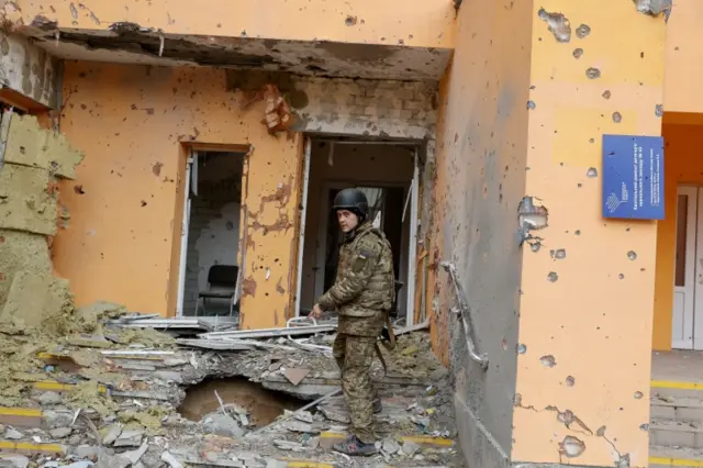 A Ukrainian service member shows a kindergarten damaged by a military strike, as Russia"s attack on Ukraine continues, in Sievierodonetsk, Luhansk region, Ukraine April 16, 2022