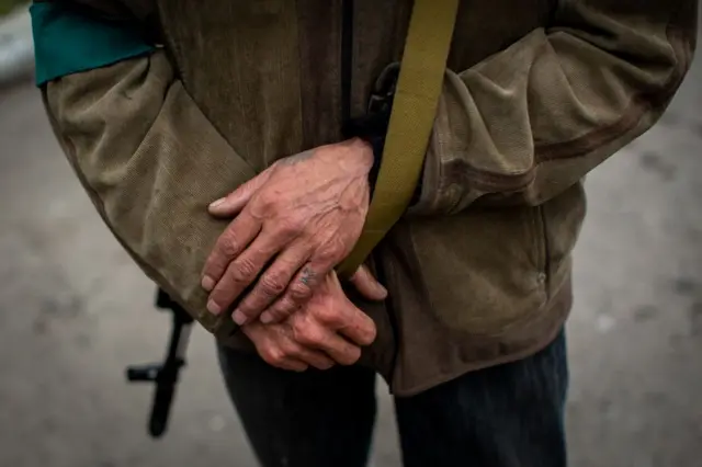 Mykola Luhynets stands with hands crossed