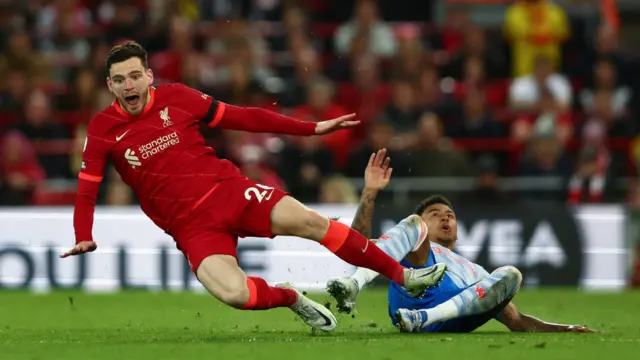 Andrew Robertson is tackled